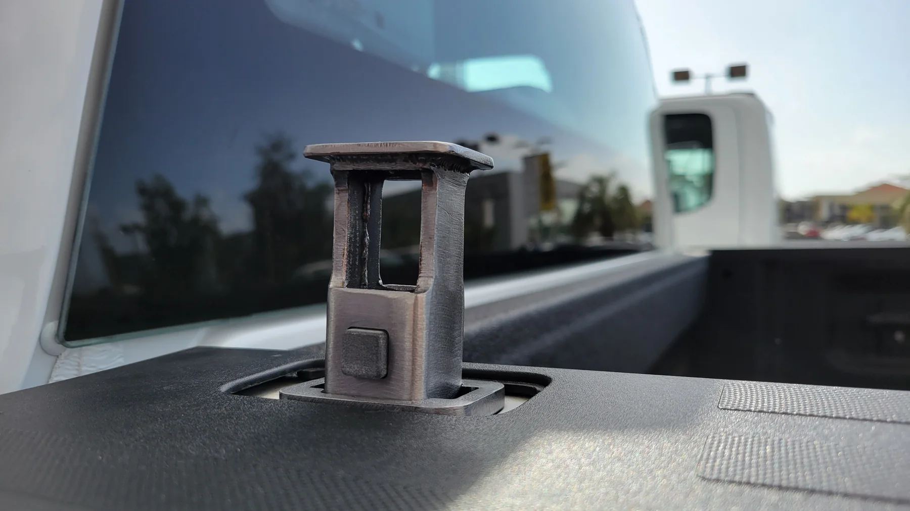Pocket Anchor metal prototype installed in a pickup truck stake pocket